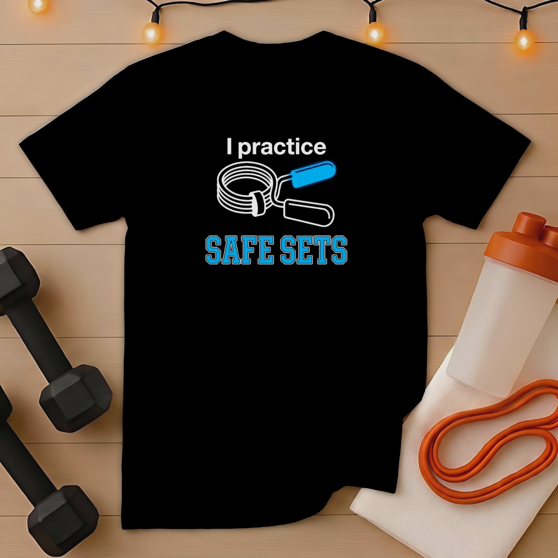 Black t-shirt with "I practice SAFE SETS" text and dumbbell graphics.