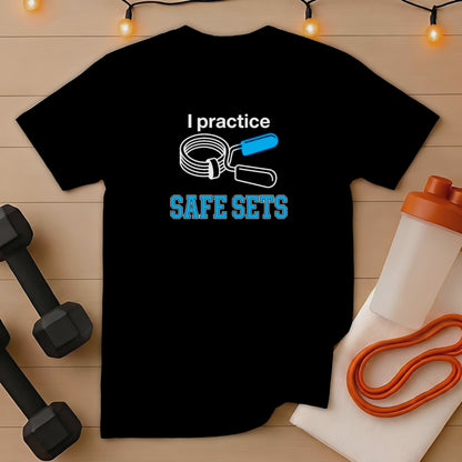 Black t-shirt with "I practice SAFE SETS" text and dumbbell graphics.
