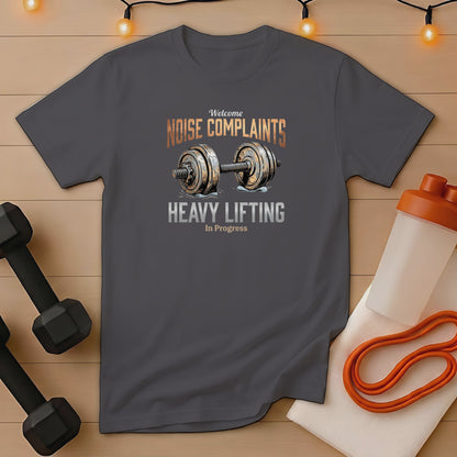 Dark grey t-shirt with "Welcome NOISE COMPLAINTS HEAVY LIFTING In Progress" graphic.