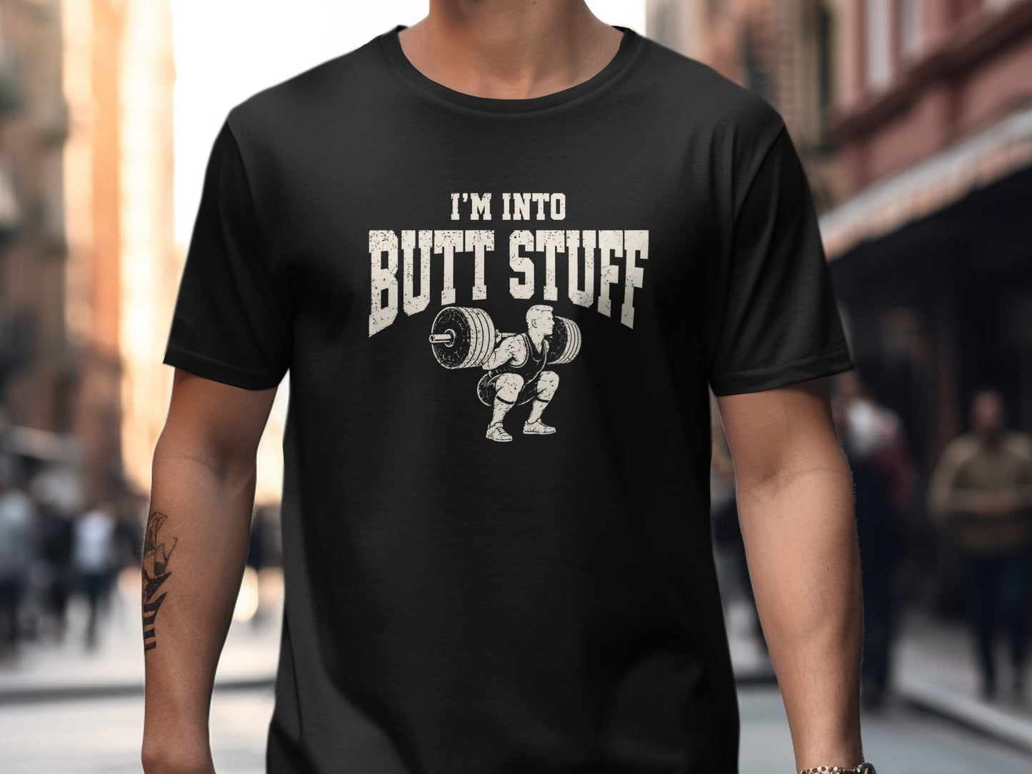 Black t-shirt with "I'M INTO BUTT STUFF" text and weightlifter graphic.