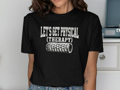 Black t-shirt with white text "LET'S GET PHYSICAL (THERAPY)" and foam roller graphic.