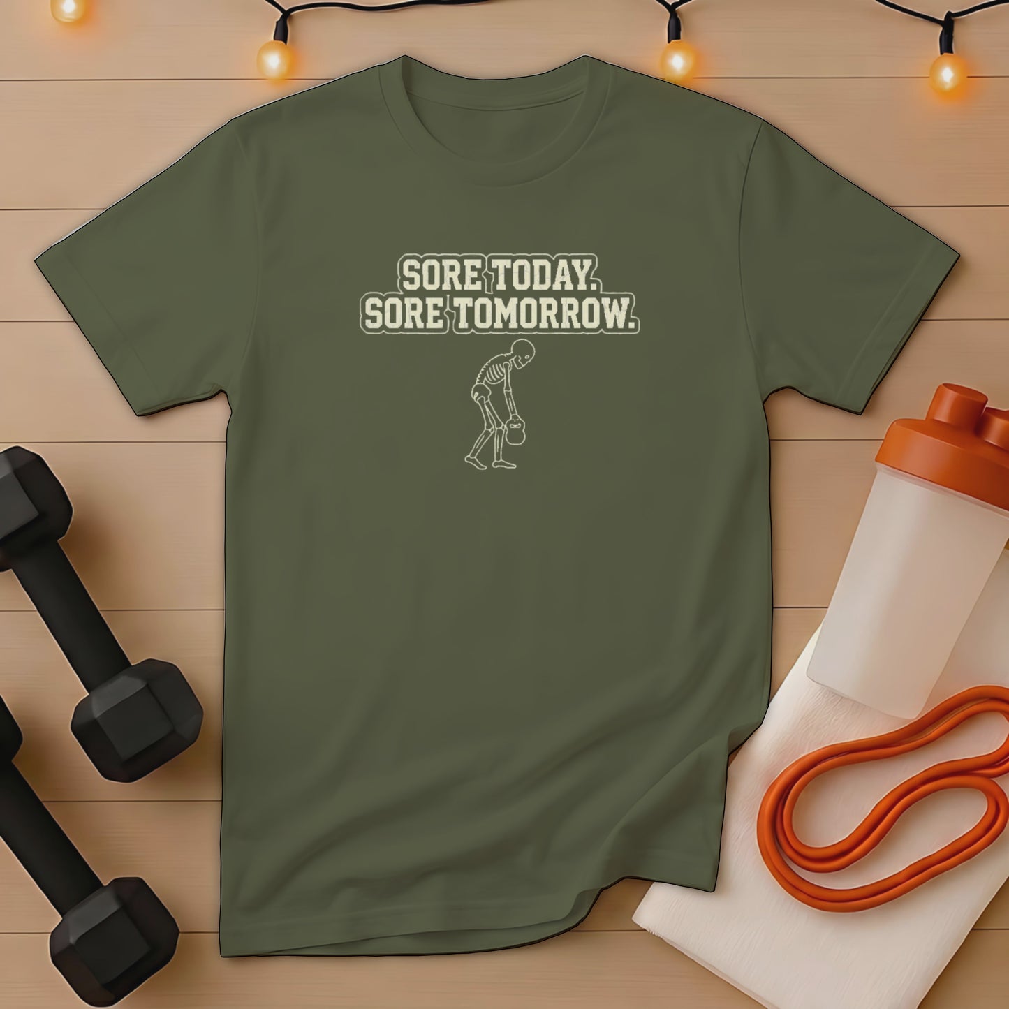 Olive green t-shirt with skeleton lifting weight and "Sore Today, Sore Tomorrow" text.