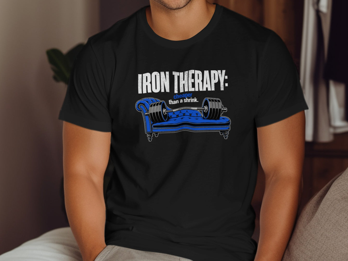 Black t-shirt with "IRON THERAPY: cheaper than a shrink." and a dumbbell on a couch.