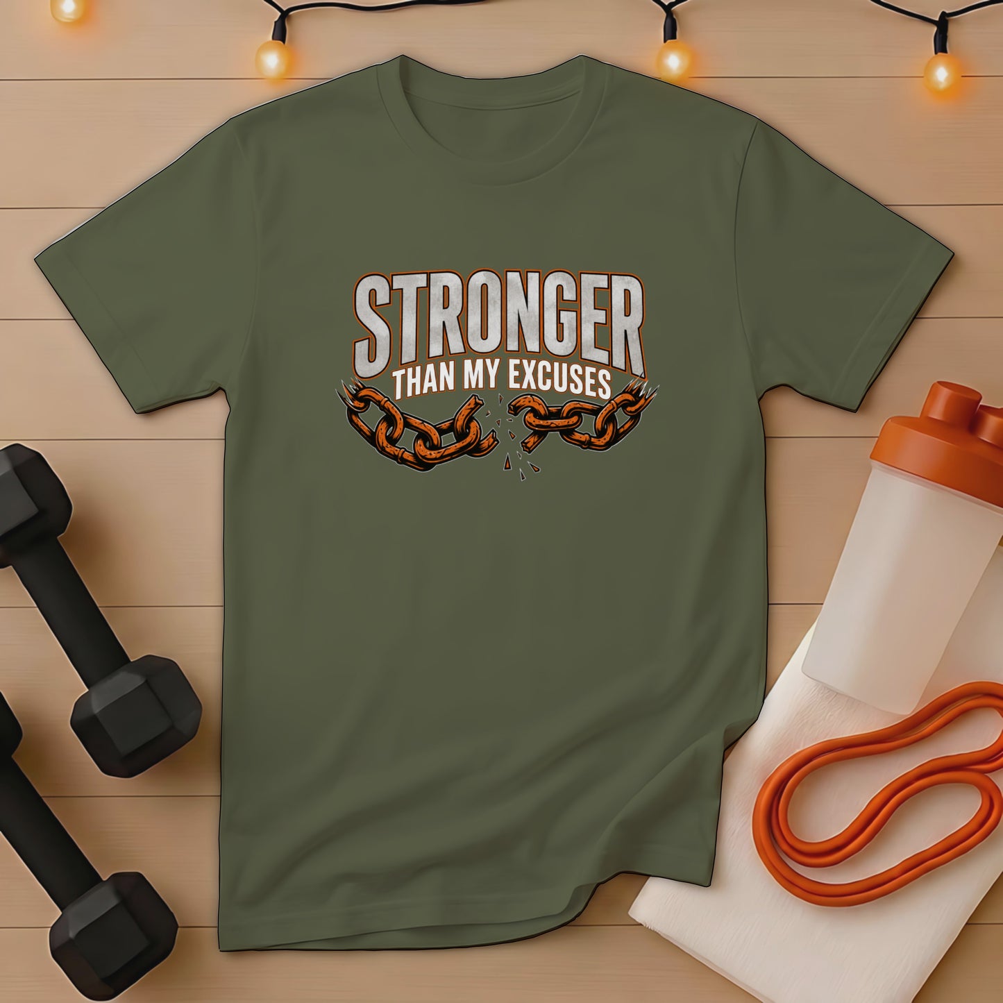 Olive green t-shirt with "STRONGER THAN MY EXCUSES" and broken chain graphic.