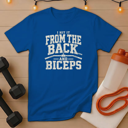 Blue t-shirt with distressed text "I HIT IT FROM THE BACK... AND BICEPS" with gym accessories.