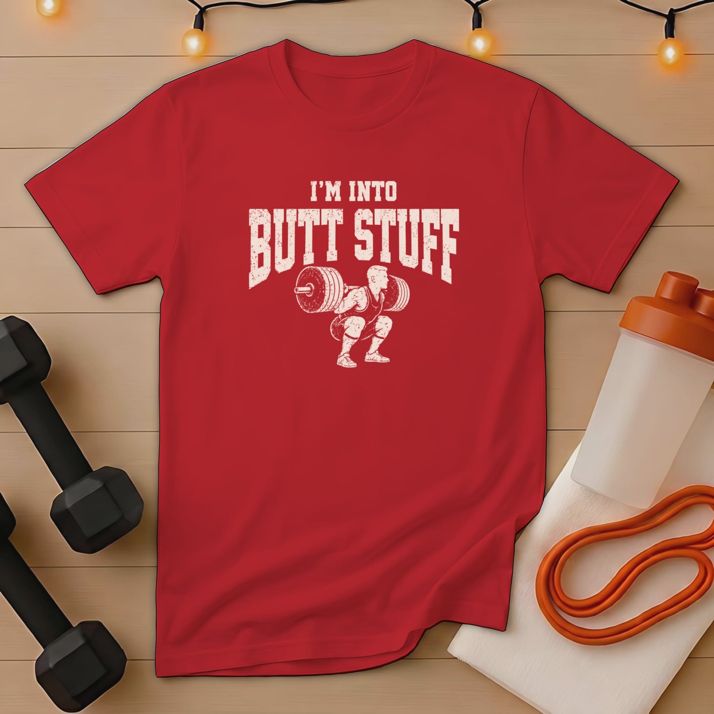Red t-shirt with white graphic text "I'M INTO BUTT STUFF" and weightlifter.