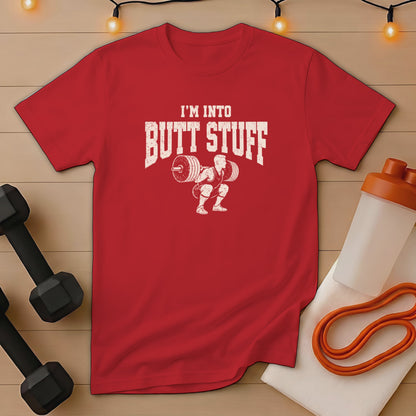 Red t-shirt with white graphic text "I'M INTO BUTT STUFF" and weightlifter.